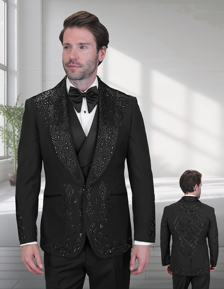 A man models the STATEMENT CLOTHING | GIOVANI-B-BLACK tuxedo by Statement Clothing, featuring a modern fit, Italian design, and decorative beading with rhinestones; the rear view of the outfit is visible in the background.
