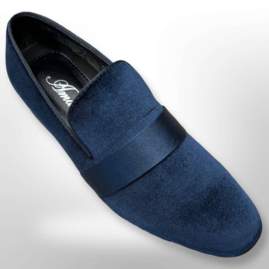 The Fiesso Shoe 13, available only in size 10 and sold as a final sale with no exchanges or returns, is displayed on a white background. The dark blue velvet loafer features a glossy band across the top and is depicted from a slightly elevated perspective.