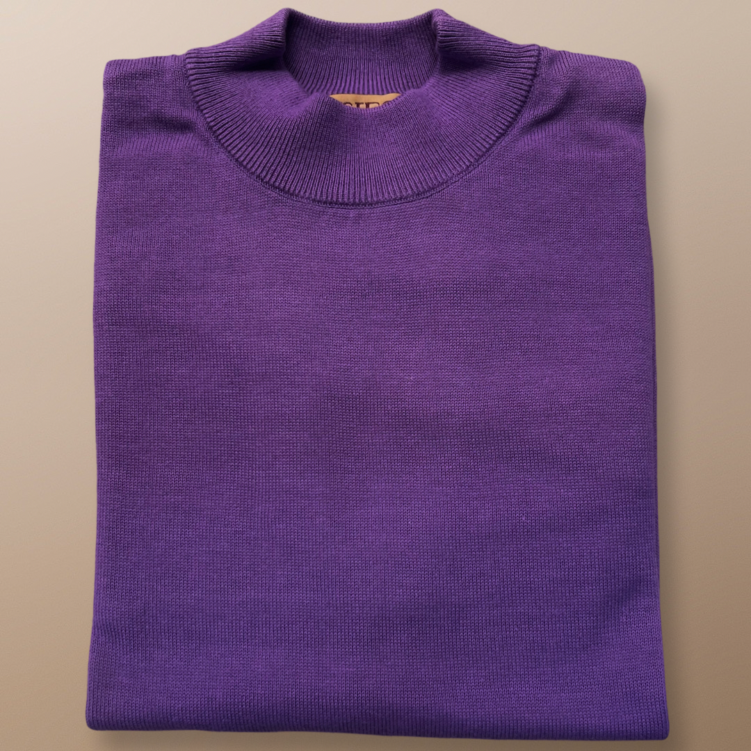 The Inserch Cotton Blend Mock Neck Sweater in Amethyst (4308-00180) is elegantly displayed on a beige surface, highlighting its regular fit and soft cotton blend.