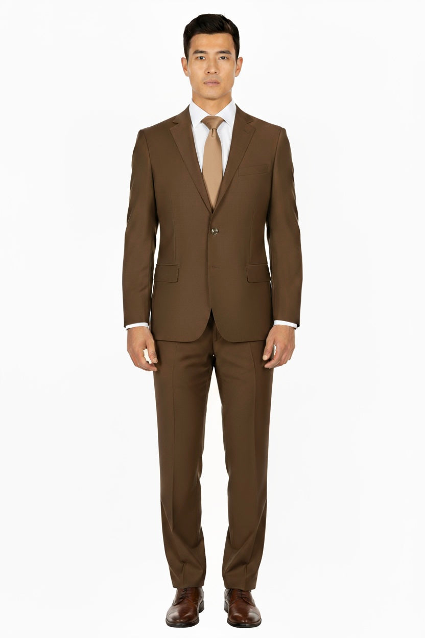 A man stands facing forward wearing the Tobacco Porto Slim Fit, Pure Wool Suit by Tiglio Luxe—tailored from luxury Italian fabrics—paired with brown dress shoes, a white dress shirt, and a tan tie against a plain white background.