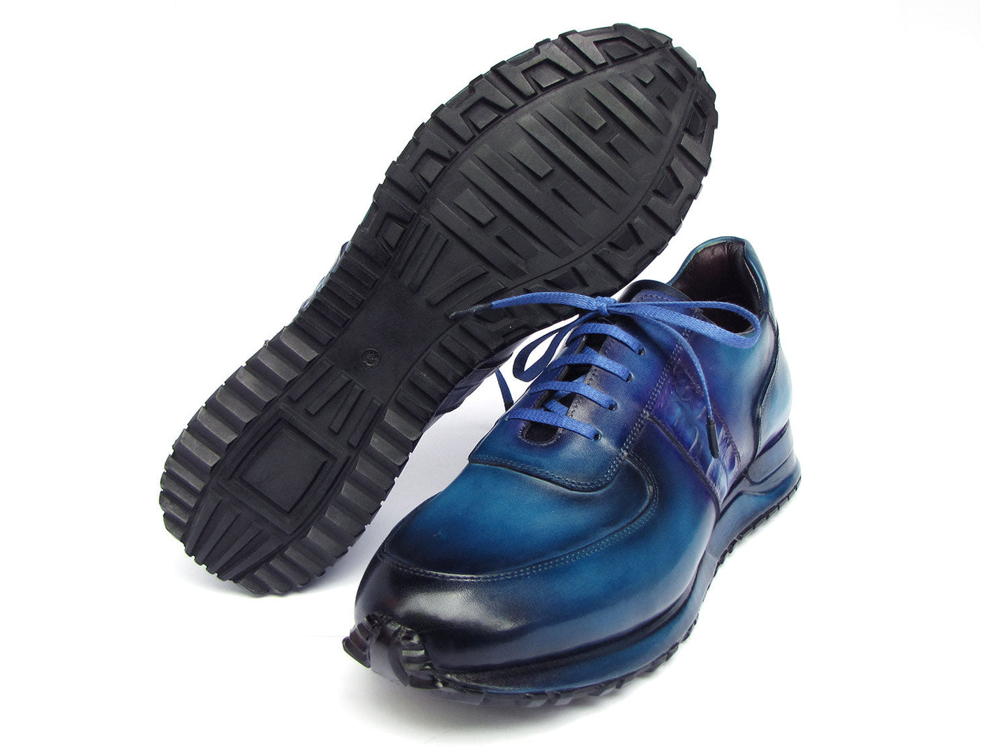 The Paul Parkman Men's Turquoise & Purple Patina Sneakers - LP207TQP showcase a striking blue gradient design, meticulously crafted from hand-painted leather and featuring laces and textured soles, delivering both style and exclusivity.