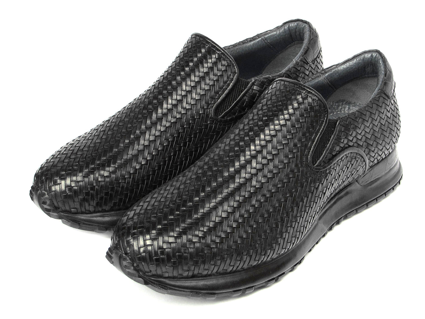 The Paul Parkman Men's Black Woven Leather Slip-On Sneakers - LW204BLK are black men's slip-on fashion sneakers with a woven pattern and durable rubber soles.