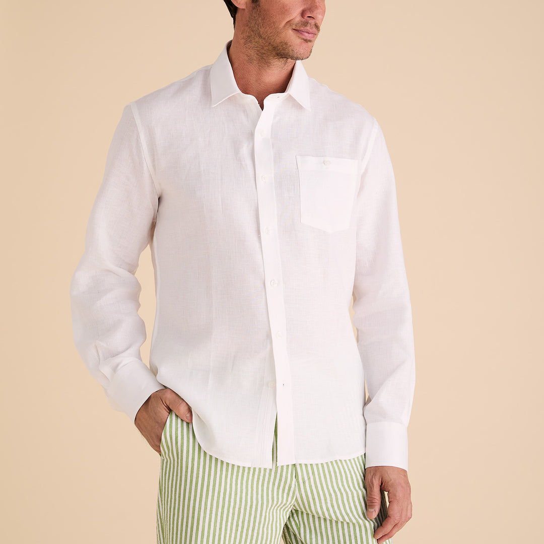 A model wearing the Inserch Long Sleeve Modern Fit Linen Shirt LS880-00002 White and green striped pants is posed against a beige backdrop, highlighting the elegance of premium European linen.