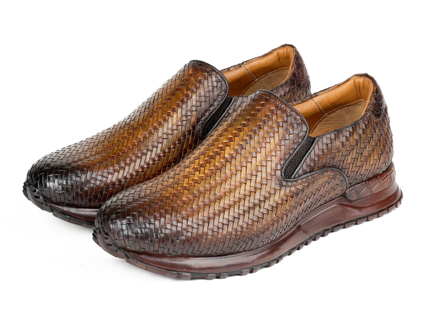 A pair of Paul Parkman Men's Brown Woven Leather Slip-On Sneakers (LW204BRW) featuring a textured sole and tan lining.