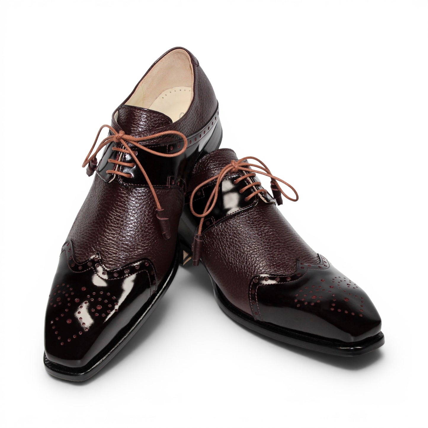 An Emilio Franco Luciano Burgundy oxford shoe, crafted from premium leather in a rich burgundy shade, features laces, classic wingtip detailing, and a polished finish on the toe and side panels, displayed in profile against a white background.