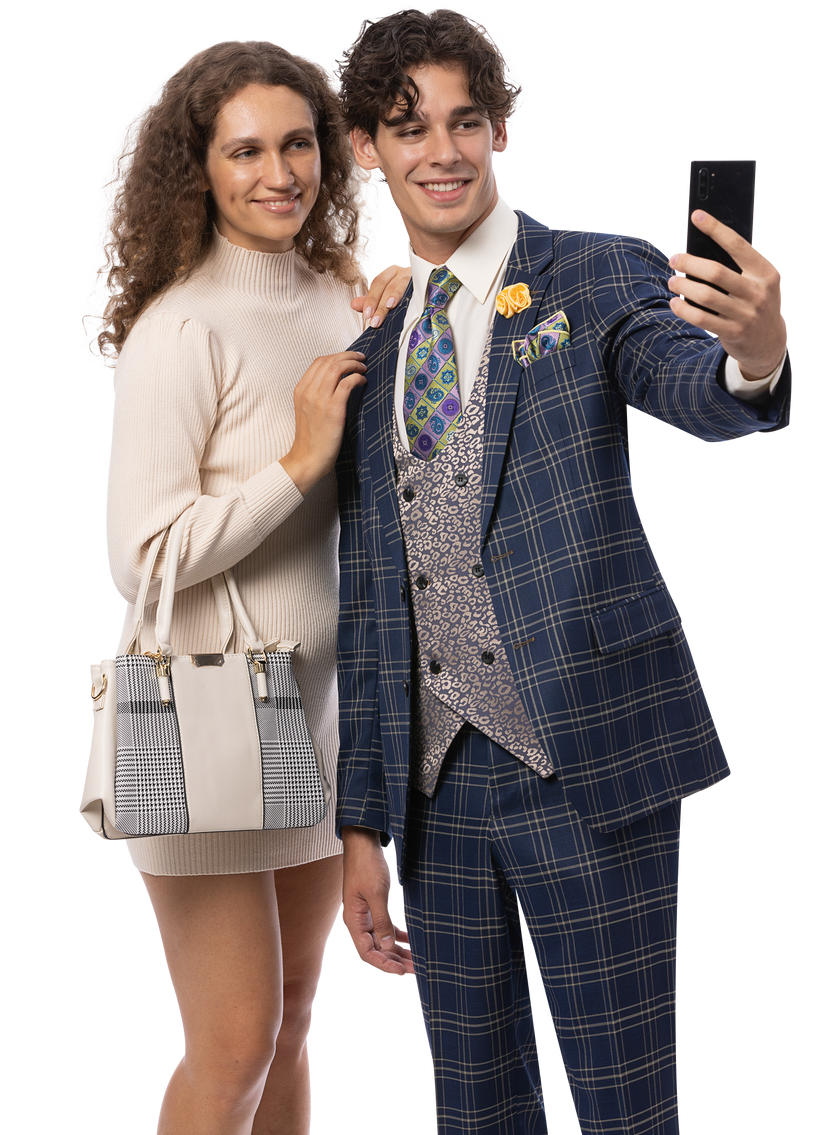 A woman in a light dress stands beside a man wearing the EJ Samuel Blue Suit M2814 by EJ SAMUEL and a fancy vest as he takes a selfie with his smartphone.