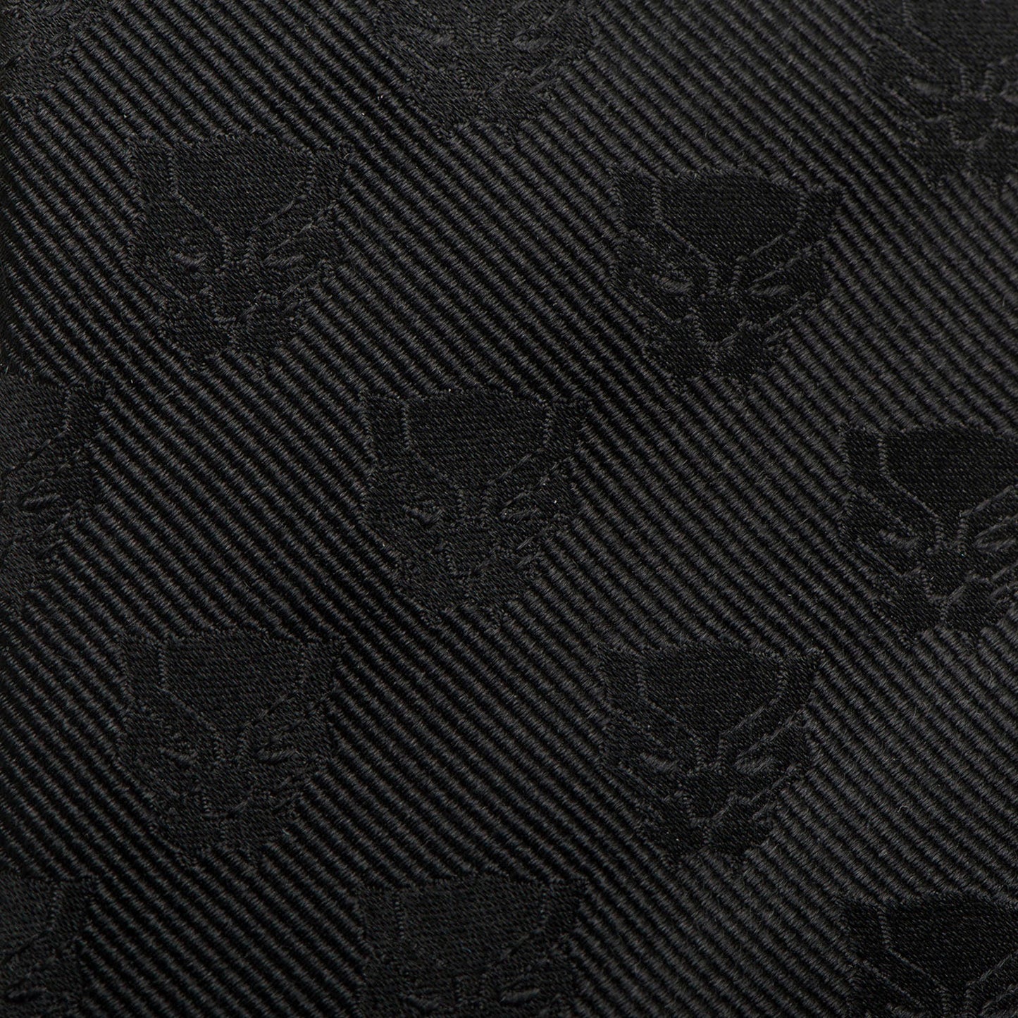 The Marvel Black Panther Men's Tie by Cufflinks.com is a rolled-up woven silk tie featuring a subtle, repeating pattern of the iconic mask emblem.