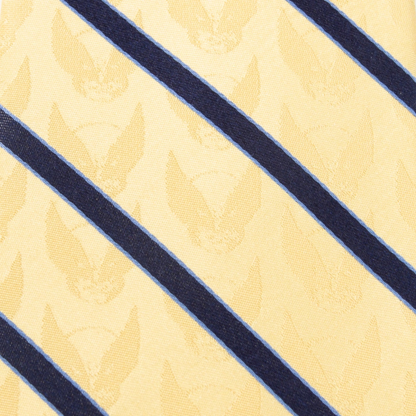 The Marvel X-Men Wolverine Yellow and Navy Stripe Silk Men's Tie by Cufflinks.com, featuring a subtle pattern and diagonal navy stripes, is rolled up on a white background.