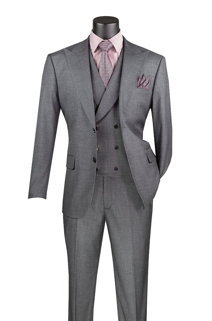 The Vinci Suits Modern Fit 3 Piece Suit in charcoal, featuring adjustable waistband pants, is displayed on a mannequin with a pink shirt, patterned tie, and matching pocket square.