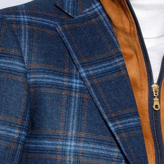 A man in an Insomnia MANZINI MZW-535 indigo plaid blazer coat with a tailored fit, white turtleneck, brown vest, and jeans stands against a light-patterned wall, looking to the side.