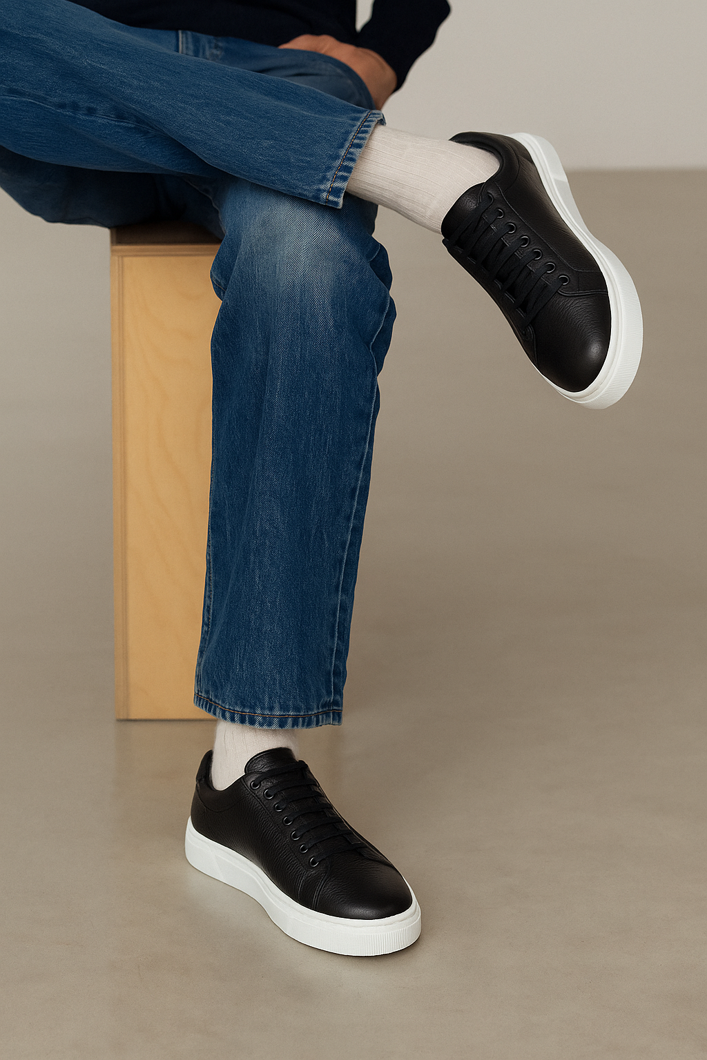 The BELVEDERE Matteo is a black genuine deerskin leather low-top sneaker with black laces, a white rubber sole, and cushioned insole, pictured in side profile against a plain white background.