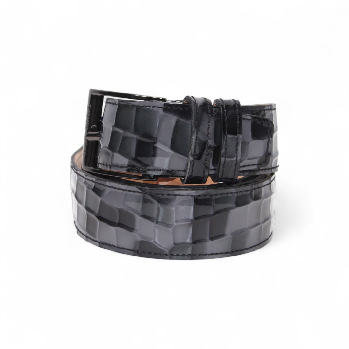 The Matiste Grey Leather Belt NS1 by Matiste features hand-finished Italian leather with a textured surface and a large round buckle engraved with a lion's head design.