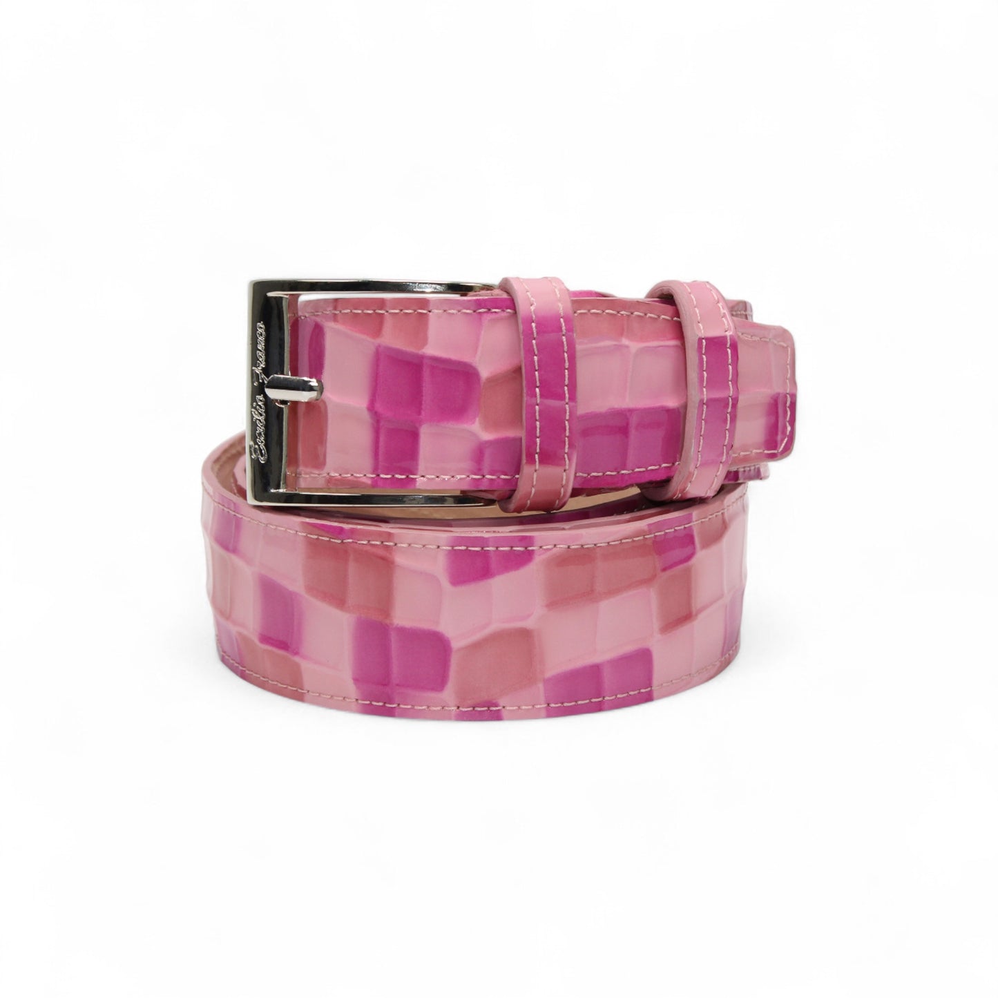 The Matiste Pink Leather Belt NS1 by Matiste is a luxurious checkered pink belt with a large, round silver buckle adorned with a lion's head design.
