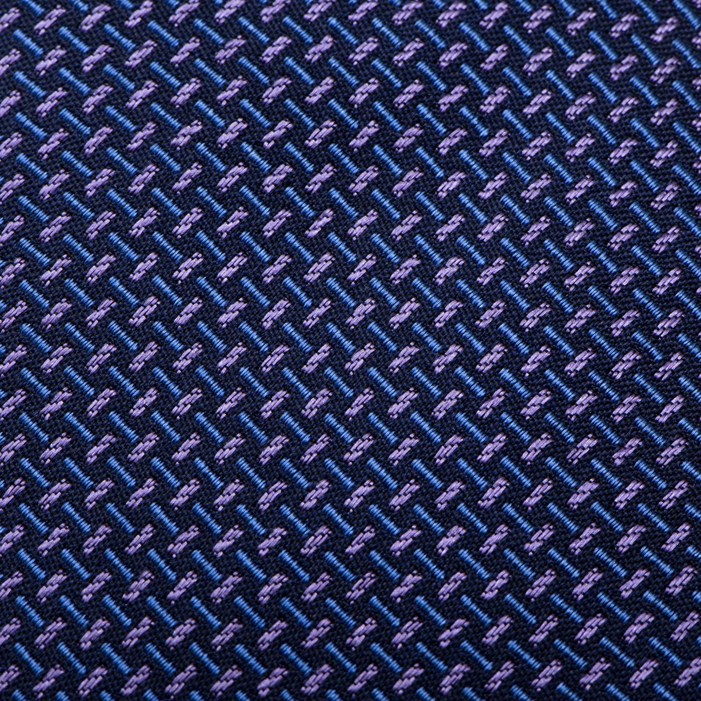 The Mitchell Tie by Cufflinks.com features an iridescent basketweave in blue and purple tones—crafted from 100% silk, it's the perfect modern addition to any men's tie collection.