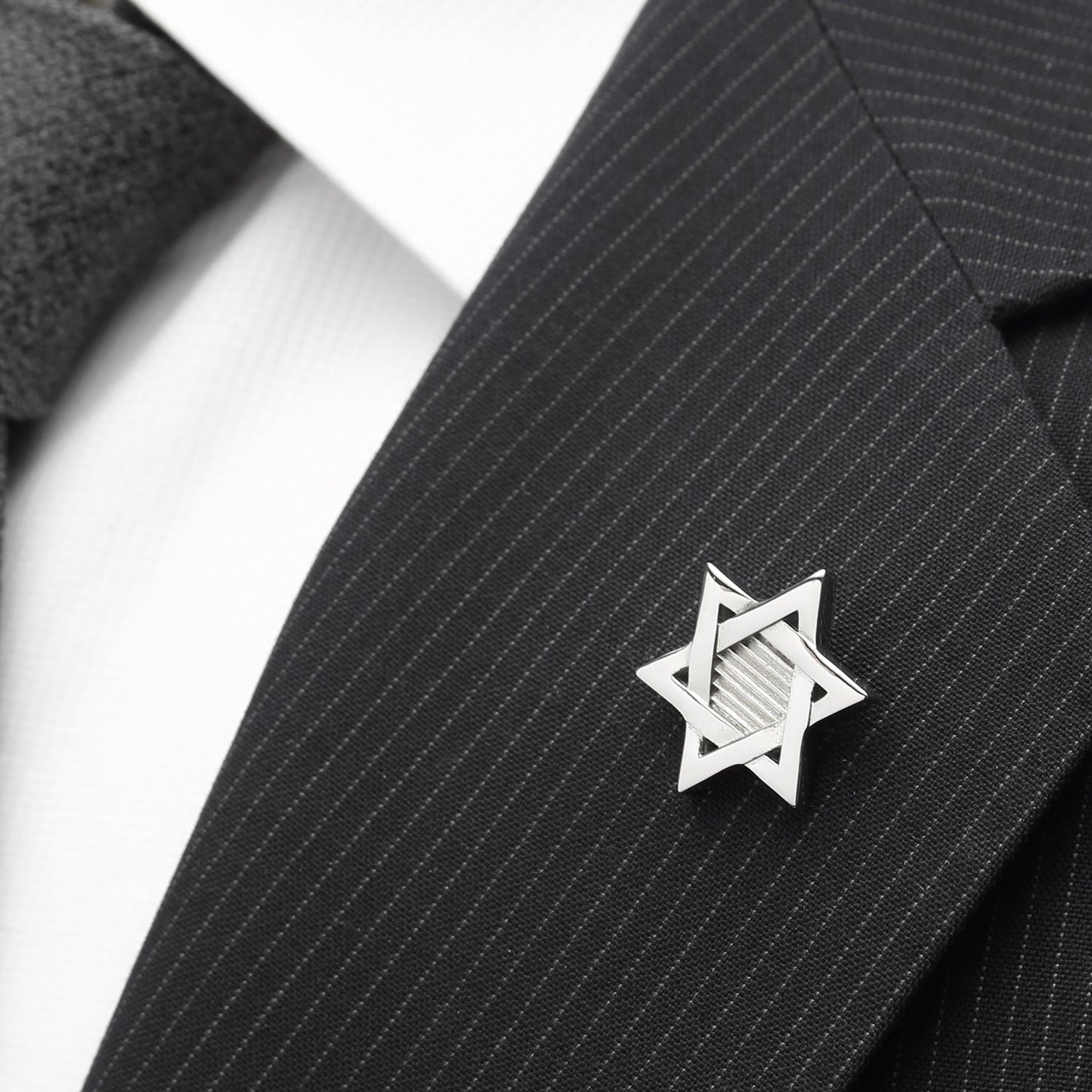 The Star of David Stainless Steel Lapel Pin by Cufflinks.com features interlocking triangles and a textured background, making it a stylish formal accessory.