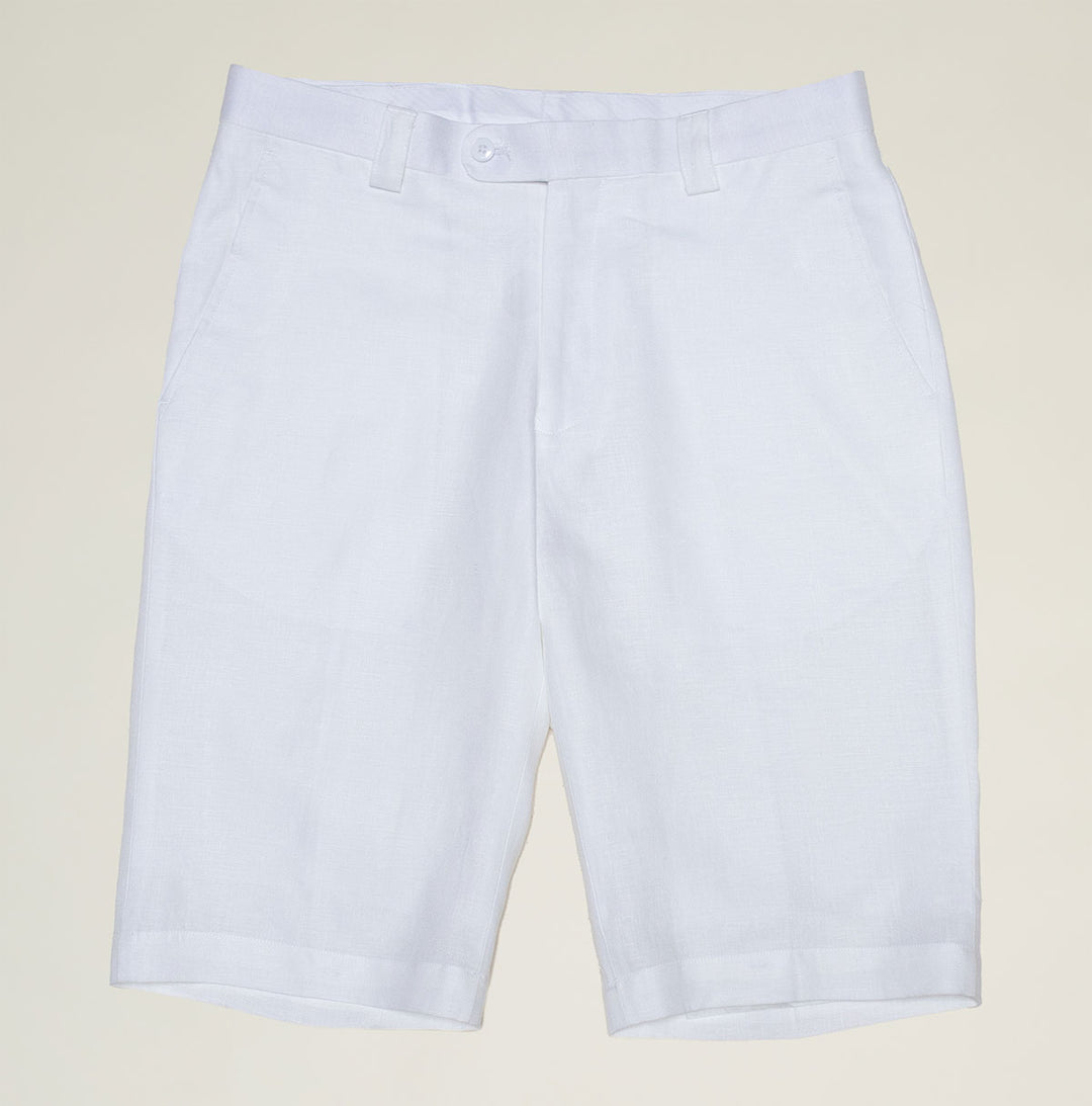A pair of Inserch Linen Shorts P2110-White by Inserch is laid flat on a wooden floor, displaying the back pockets and a faint orange stain near one pocket.