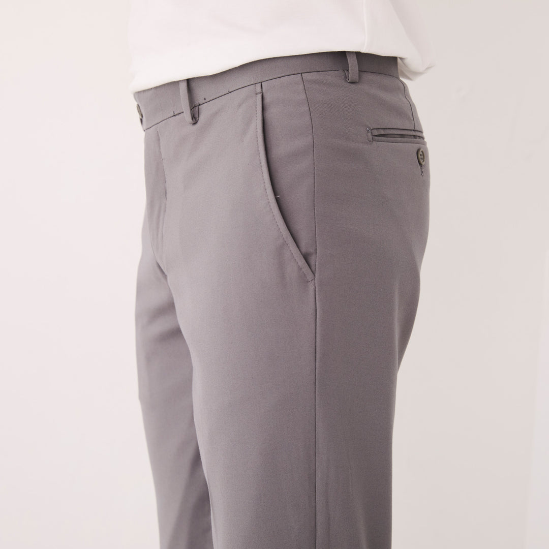 Someone wears Inserch Slim Fit Pants P3999S-33 Grey with a white shirt and black dress shoes, standing against a plain white background.
