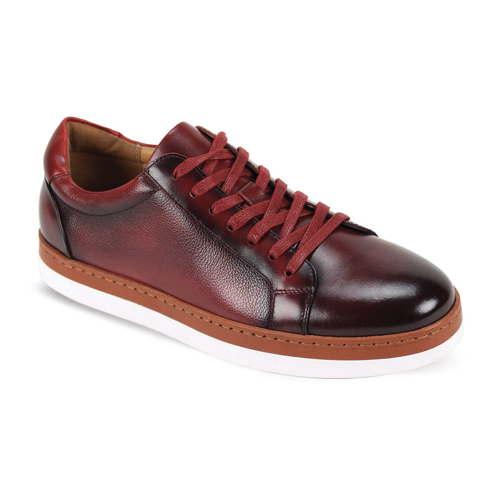 The Giovanni Porter Burgundy Leather Shoes by GIOVANNI are low top sneakers made of burgundy leather, featuring elegant red laces and a clean white sole, enhanced with a refined leather welt for extra style.