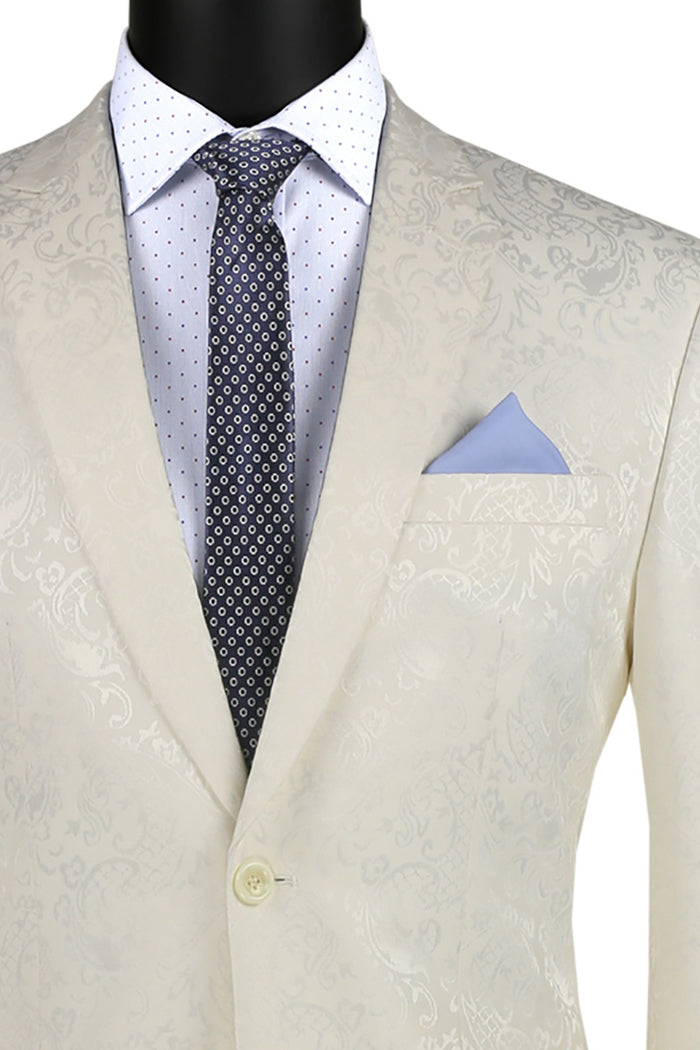 The Vinci Suits Slim Fit 2 Piece Single Breasted Suit in Ivory S2F-1 offers a sharp look with its cream-colored pattern, paired with a white shirt, polka dot tie, and light blue pocket square. Crafted from a Poly Rayon Blend for comfort and style on any occasion.