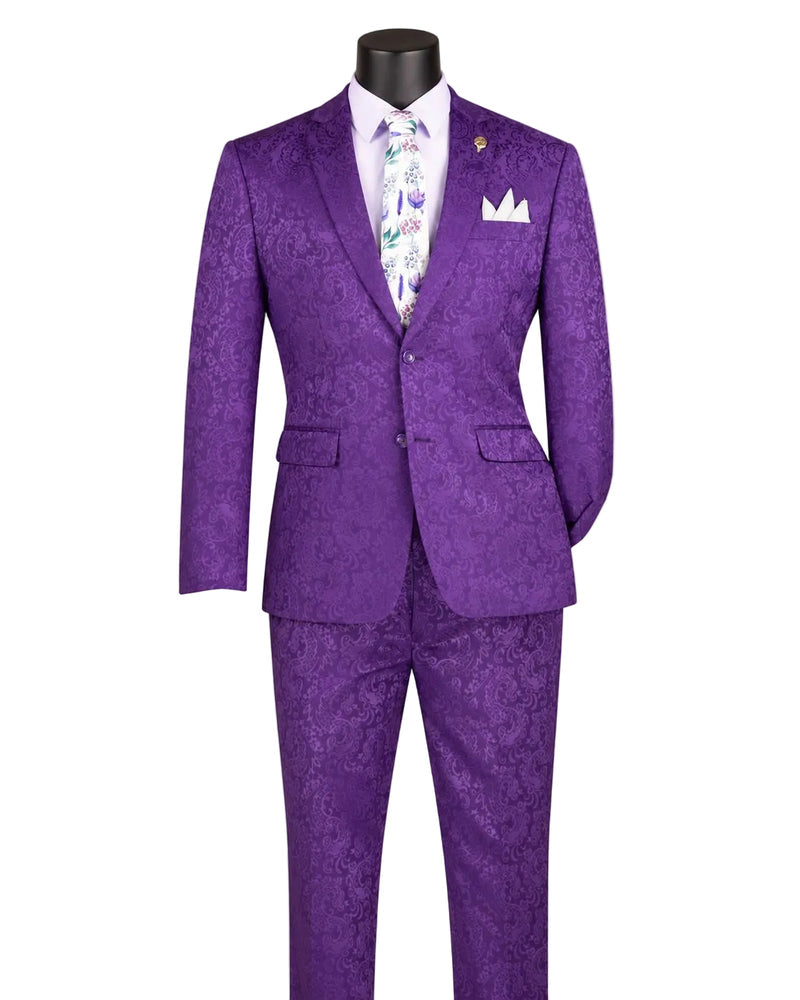 The Slim Fit Purple Tone on Tone Paisley Pattern 2 Piece Suit S2F-1 by Vinci Suits is styled with a white shirt, floral tie, and pocket square on a mannequin for a sharp formal look.
