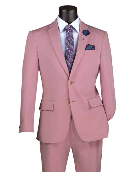 The mannequin features a Vinci Suits Slim Fit 2 Piece Suit in pink (SDX-3), paired with a white shirt, patterned tie, blue pocket square, and floral lapel pin. Made from stretch fabric, it offers comfort and wrinkle resistance with an adjustable waistband.