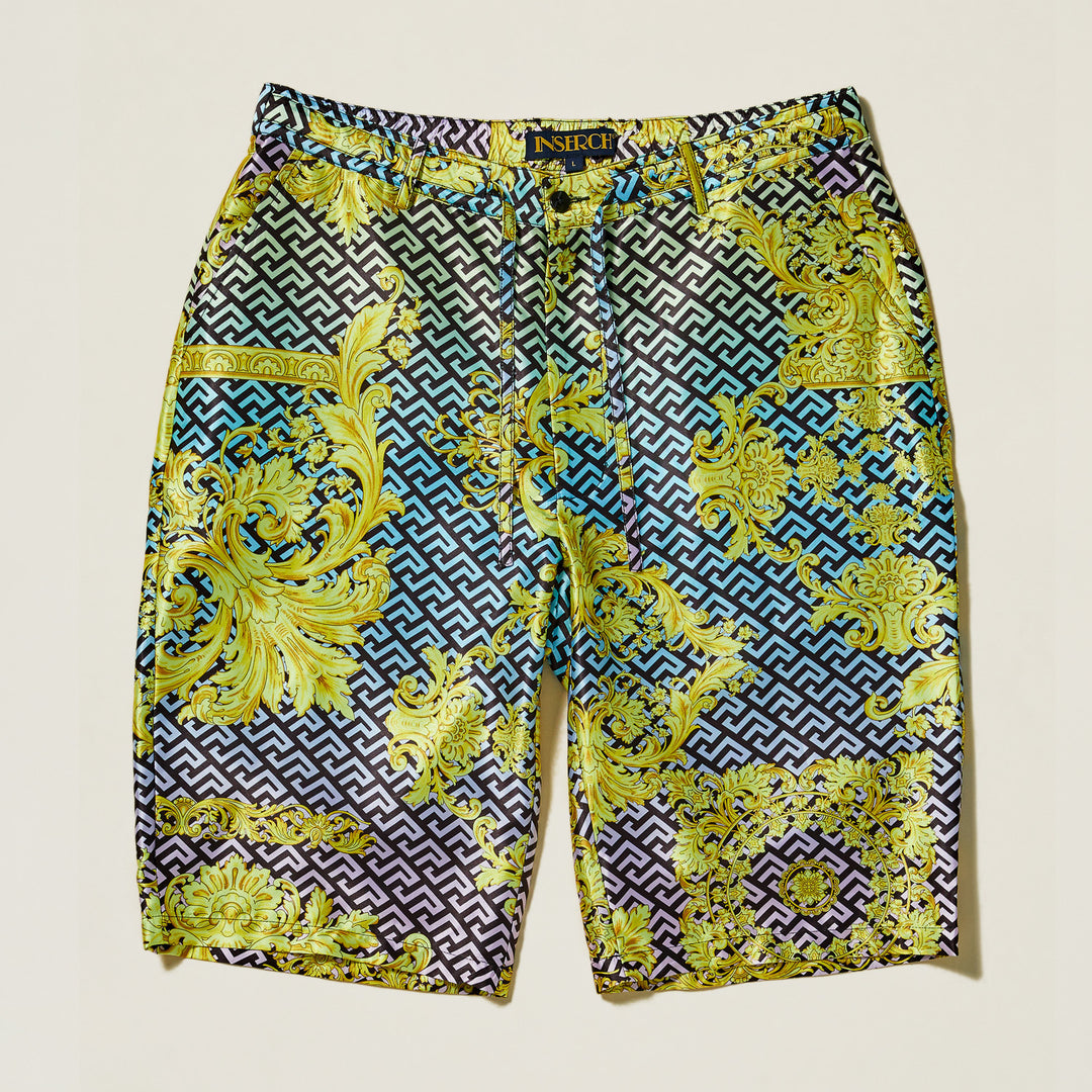 The Inserch Grecian Print Shorts ST053-00066 Multi by Inserch feature a regular fit and drawstring waist, showcasing a bold yellow and gold baroque Grecian print over a blue and black geometric background.