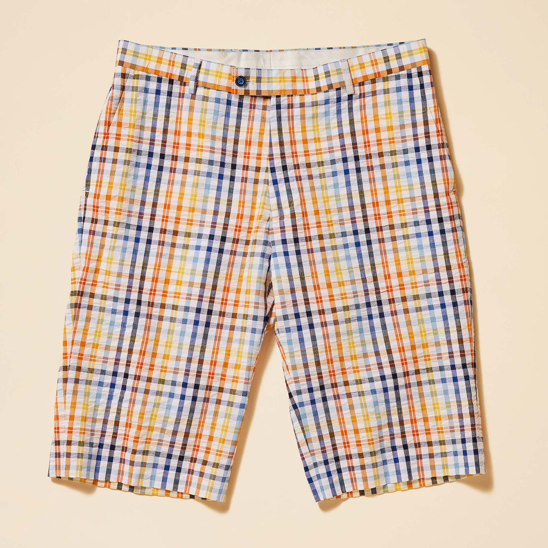 The Inserch Seersucker Check Short ST271-00056 by Inserch features a modern fit with a premium cotton construction, showcasing orange, blue, yellow, and white squares on a light beige background.