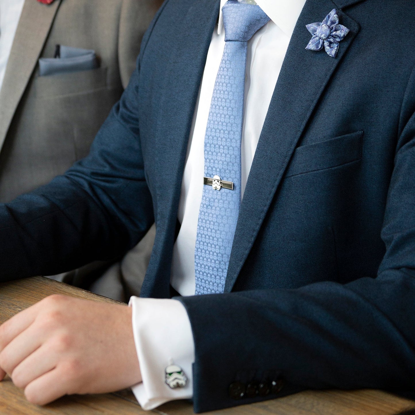 The Star Wars Darth Vader and Stormtroopers Imperial Force Blue Tie by Cufflinks.com features a subtle repeating Darth Vader pattern and a prominent Darth Vader head embroidered near the tip.