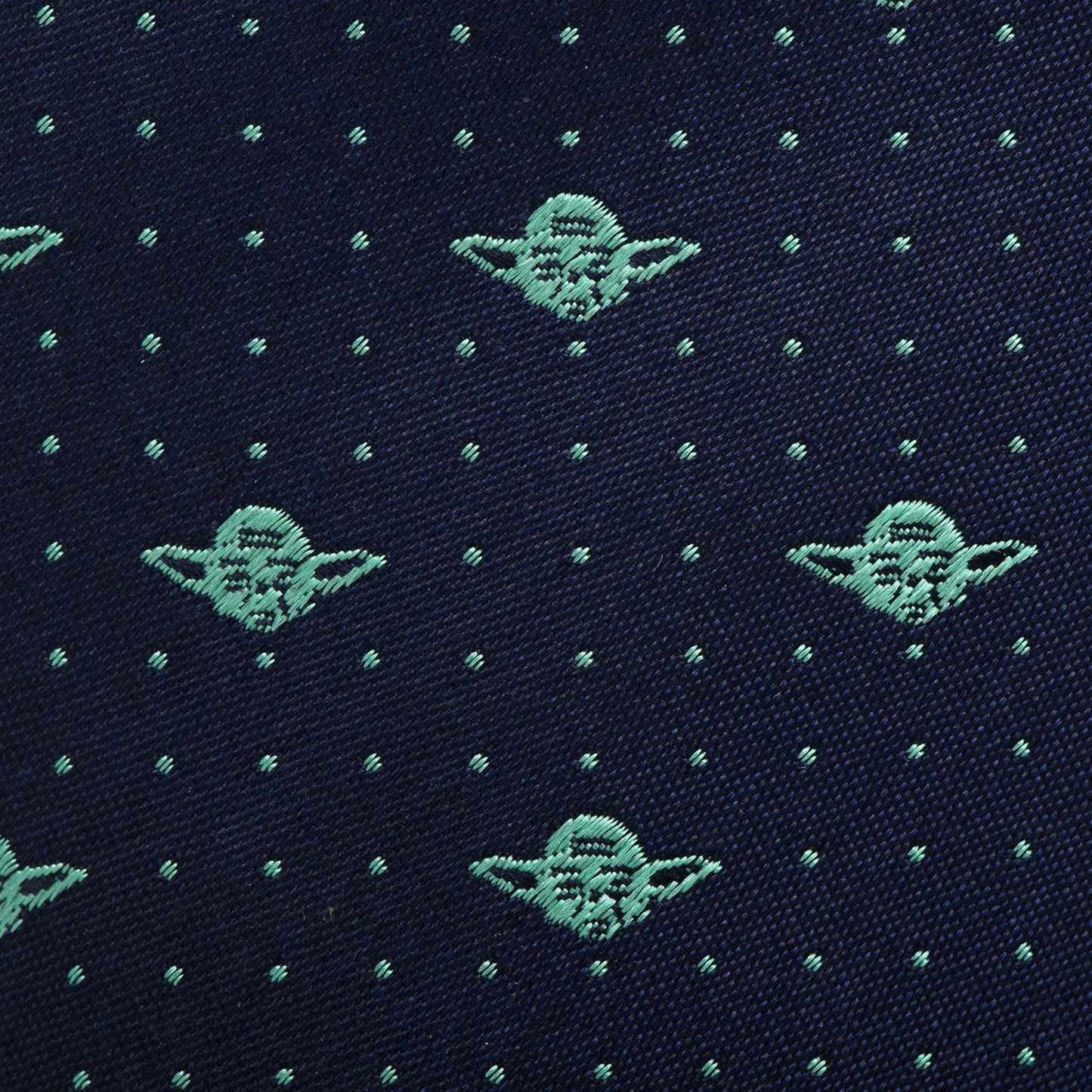 The Star Wars Yoda Dotted Navy Tie by Cufflinks.com features a playful pattern of small green Grogu faces and dotted accents—a fun accessory for Star Wars fans.