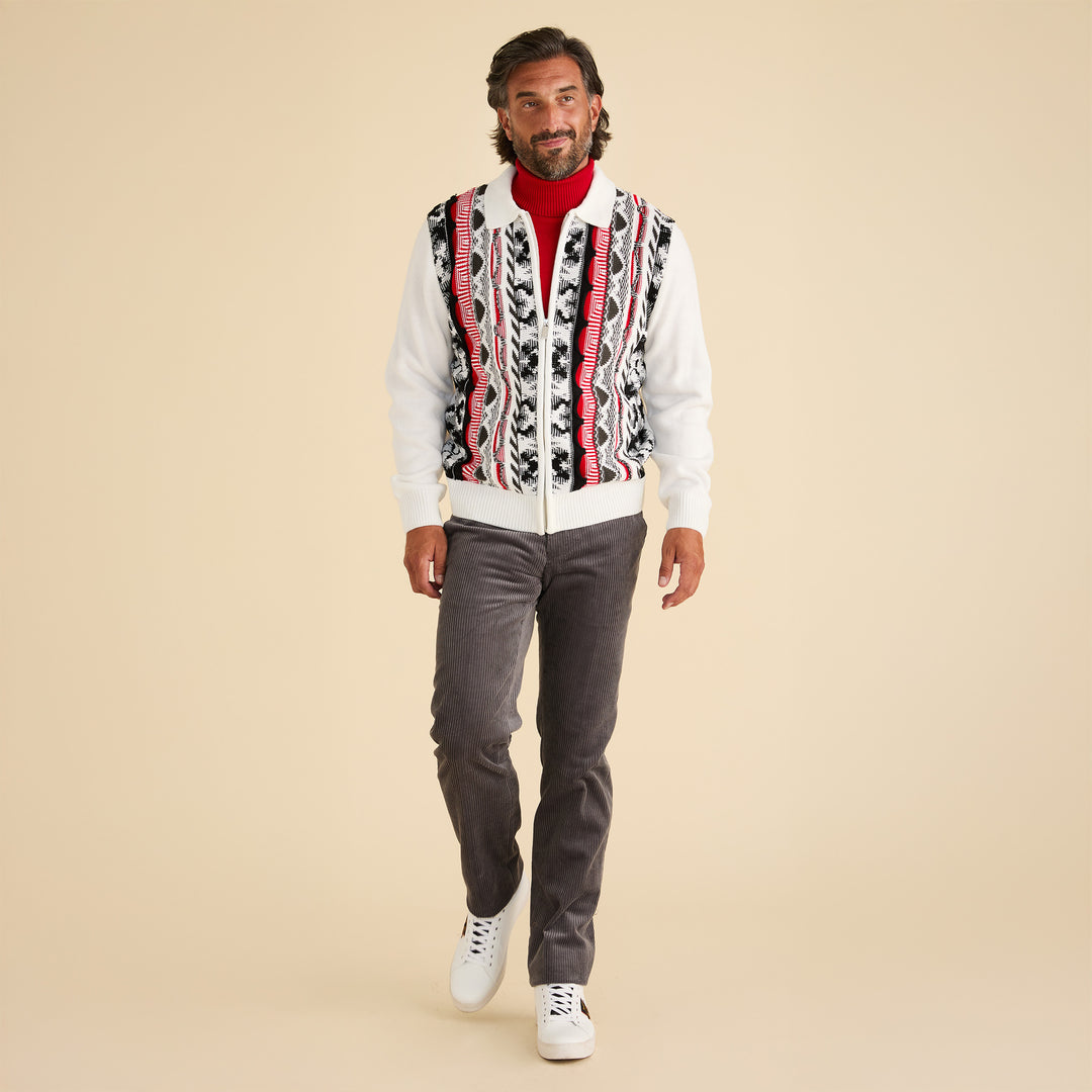 A man wearing the Inserch 3D Intarsia Full Zip Sweater SW907-02 White stands against a beige background, paired with a red turtleneck, gray pants, and white sneakers.