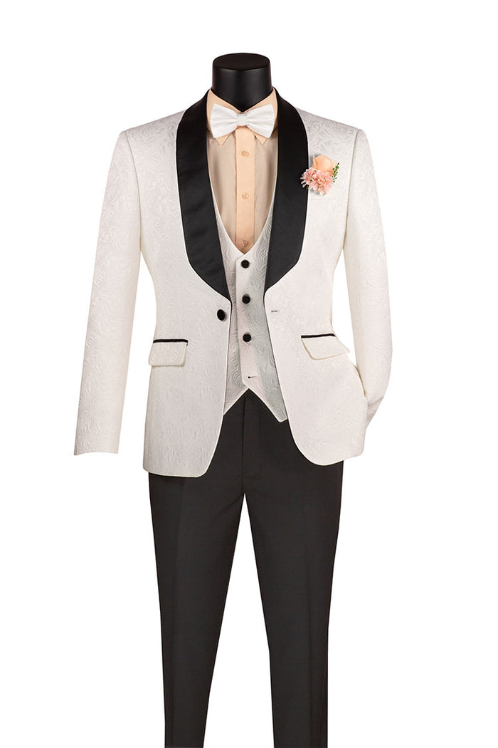 The Slim Fit 3 Piece Single Button Jacquard Fabric Tuxedo White TVSJ-1 from Vinci Suits, featuring a white jacket with black lapels, beige dress shirt, and grey waistcoat, pairs well with slim fit black trousers. A pink boutonniere and bow tie add elegance with wrinkle-resistant fabric for lasting sharpness.