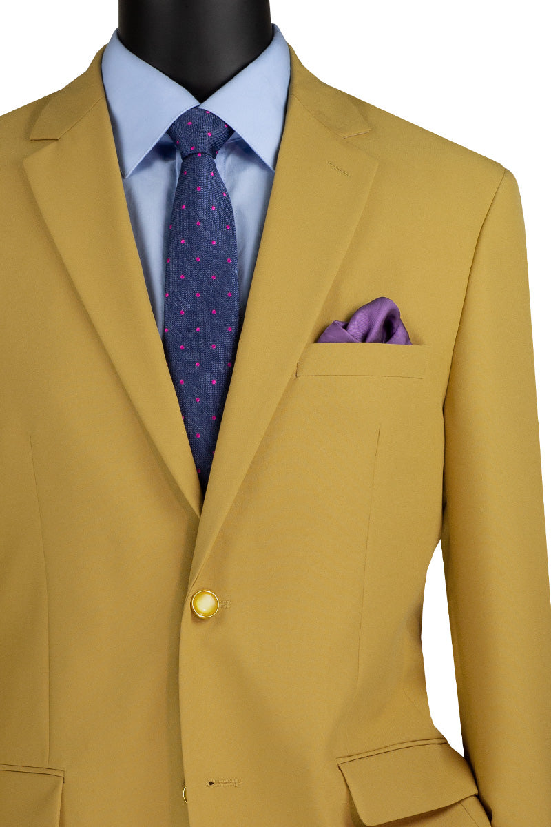 Displayed on a mannequin is the Vinci Suits Regular Fit 2 Button Business Blazer in gold, paired with a light blue shirt, dark blue tie with pink dots, and a purple pocket square. Perfect for wrinkle-resistant style in any professional setting.