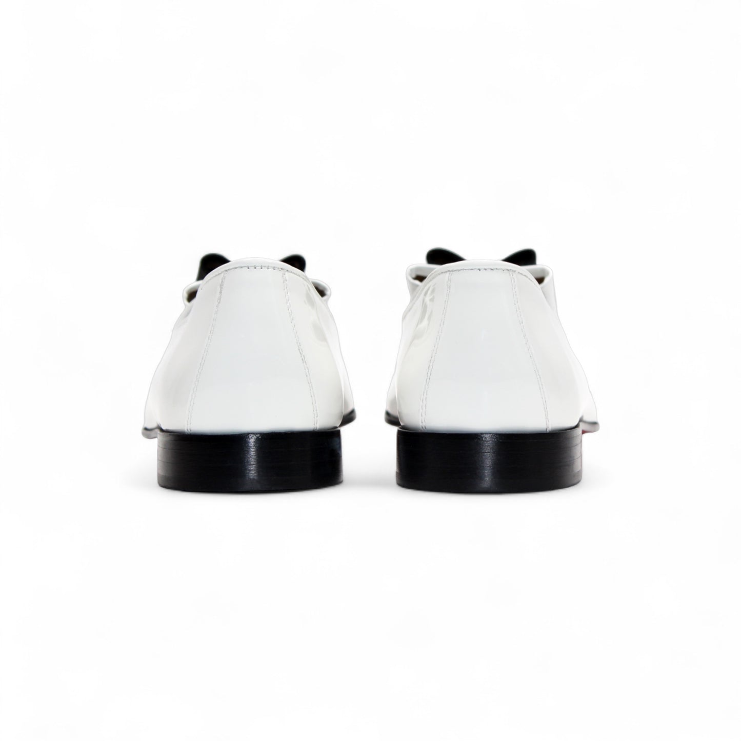 The Duca Di Matiste Duca Amalfi White/Black loafer features Italian-made white leather, a black sole, black upper detail, and a black and white bow, shown in side profile on a white background.