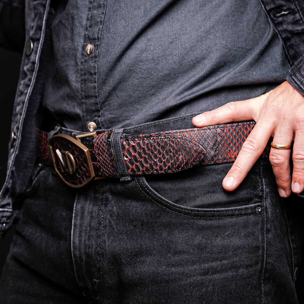 The Arkansas Belt BlackCherry by Marco Di Milano is a black and red genuine python skin western belt with a gold "MD" buckle on a white background.