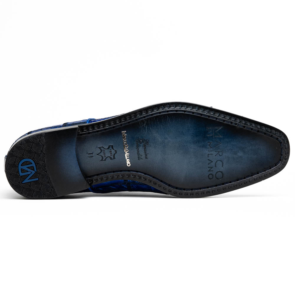 The Asti Electric Blue by Marco Di Milano features hand-painted blue crocodile-patterned leather dress shoes—one upright, one on its side showing the sole—highlighting genuine exotic craftsmanship and luxury style.