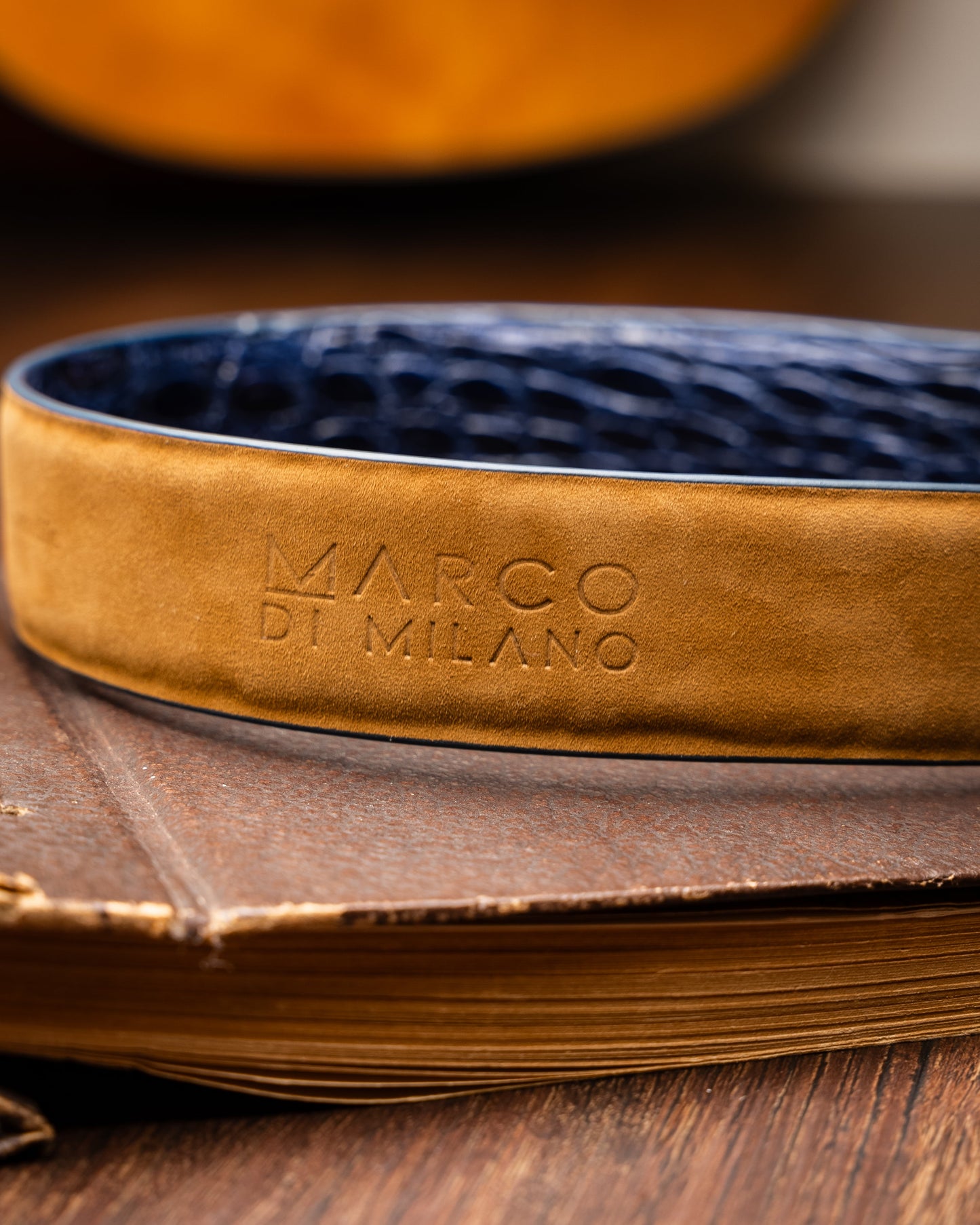The Massimo Belt Navy by Marco Di Milano features blue crocodile-embossed leather, a silver rectangular buckle engraved with "MD," inspired by genuine caiman flank belts, and finished with elegant hand-painted details.