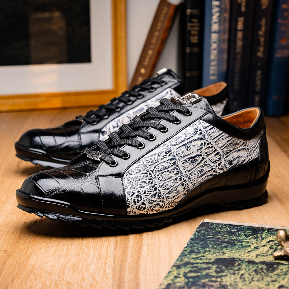 The Marco Di Milano Cairo Black/White sneakers feature a black and white low-top design, crocodile texture details, black laces, and thick black rubber soles—ideal for those seeking luxury footwear with a unique edge.