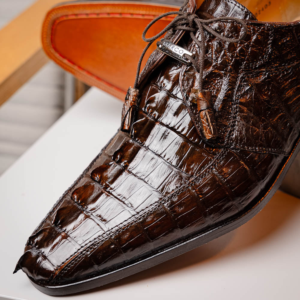 A pair of Marco Di Milano Cancun Brown derby shoes in dark brown hornback caiman crocodile leather—one displays the textured upper, while the other reveals the hand-painted exotic sole embossed with the brand.
