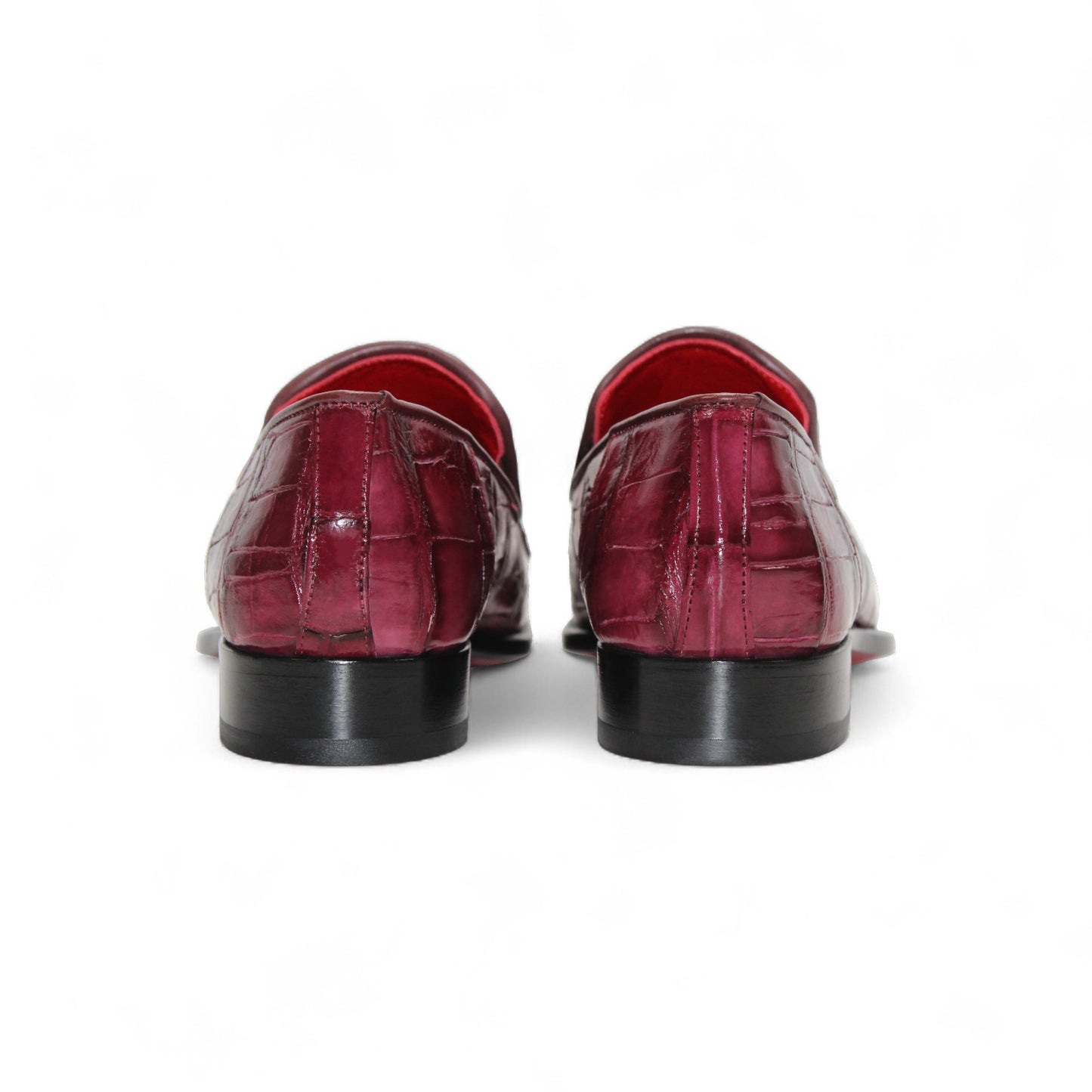 The Fennix Dustin Bordo by Fennix of Italy is a single burgundy loafer in genuine alligator leather with a crocodile pattern, leather sole, and low black heel, displayed on a white background.