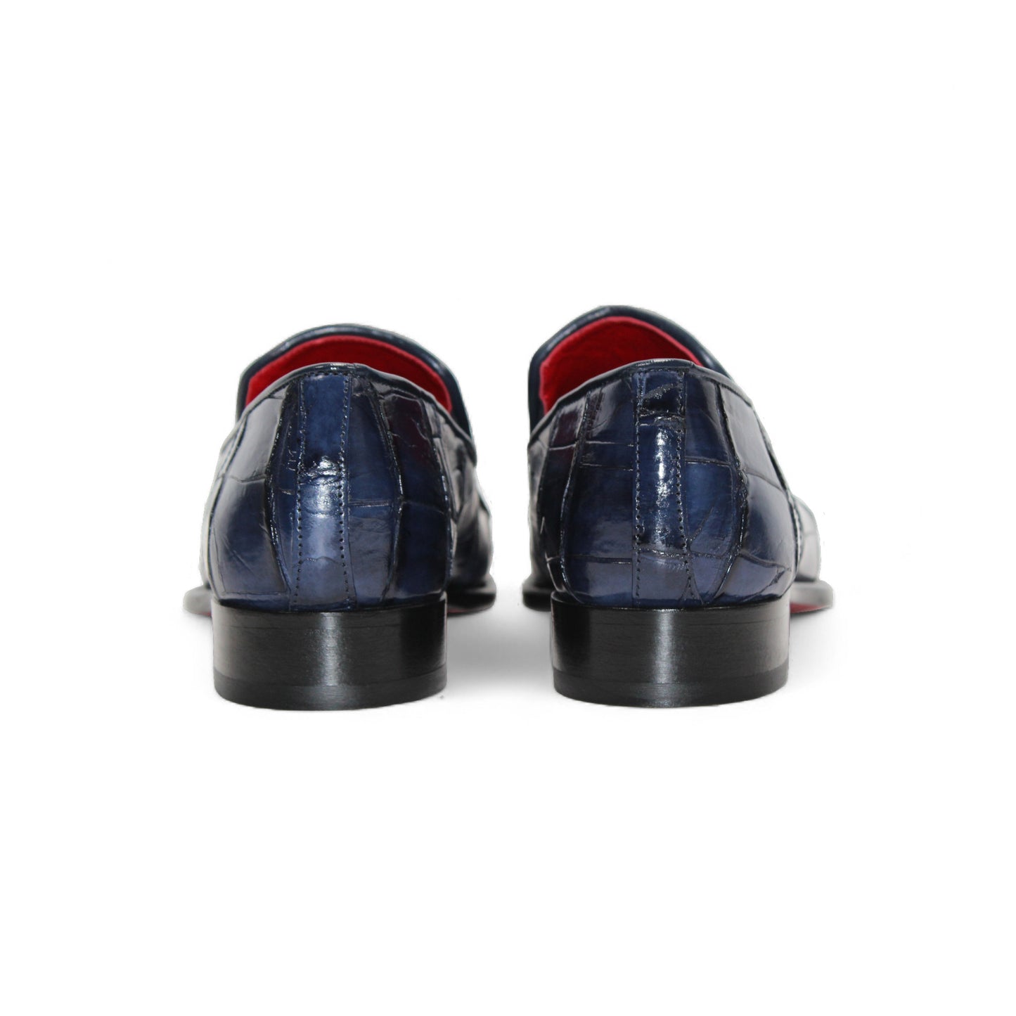 The Fennix Dustin Navy loafer by Fennix of Italy features genuine navy alligator leather with a crocodile pattern and low heel, highlighting Italian craftsmanship, shown on a white background.