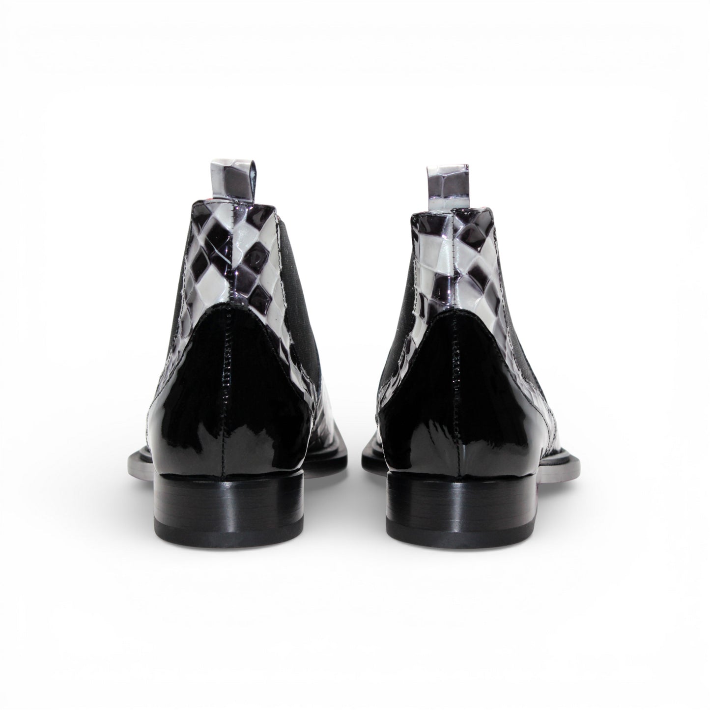 The Emilio Franco Couture EFC352 Black/White Chelsea boot features a black and white checkered design, pointed black Italian patent leather toe, black elastic side panel, and low heel—fashion-forward men's footwear by Emilio Franco Couture.