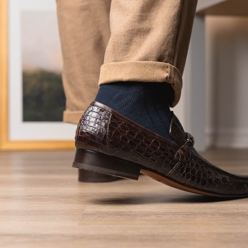 The Fabro-Tin Brown loafers by Marco Di Milano feature dark brown genuine alligator leather, metal bit detail, tan leather soles, and square toes—a true statement in luxury men's footwear.