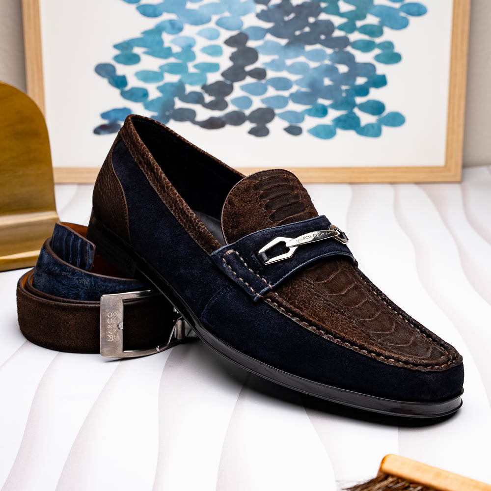 The Marco Di Milano Hugo Brown / Navy men's loafers feature dark brown textured leather, navy suede trim, a metal buckle detail, and black rubber soles for a luxurious look.