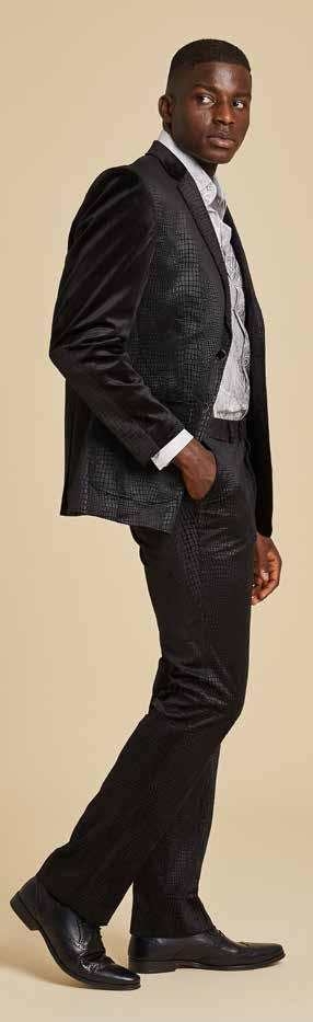 Person in an Inserch Suede Snake Skin Blazer BL268-01 Black, paired with a patterned silver shirt, poses with hand on head against a plain background.