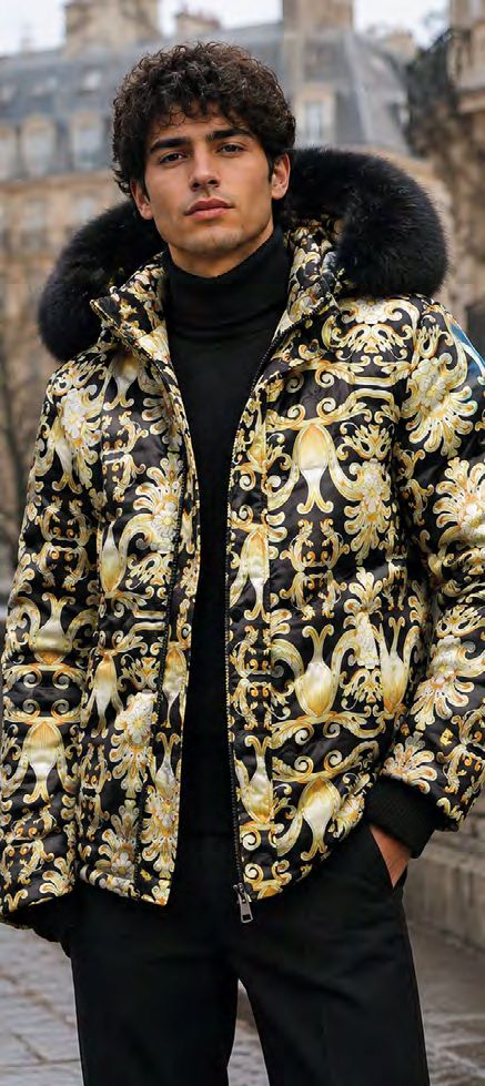 A person wearing an Insomnia MZW-410 Soft Padded Poly Zip-up Jacket w/ Removable Black Faux Fur Hood, featuring a black quilted design with a gold and white baroque pattern.