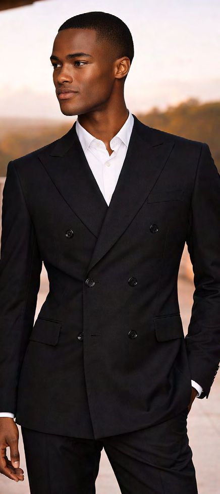 A man wearing a MANZINI LUNA 2PC Double Breasted Black Modern fit suit jacket over a crisp white collared shirt.