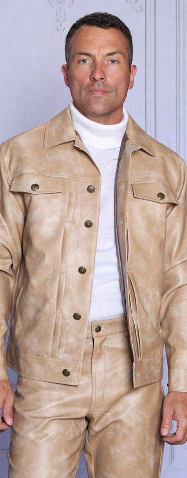 A man models the Insomnia OBAN 2PC PU Vegan Leather Casual Jacket & Pants Tan Set, standing against a light-colored wall in the brand's stylish matching outfit.