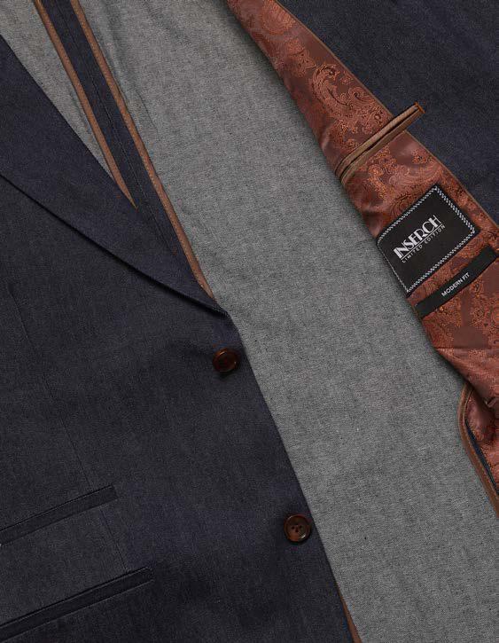 A man stands facing forward against a beige background, wearing the Inserch Denim 2pc Suit SU660281L-00195 Indigo by Inserch, styled with a brown patterned sweater and brown dress shoes.