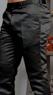 A person models Manzini MP-400 Black Satin Pants, featuring belt loops and pockets; only their lower torso and upper legs are shown indoors.