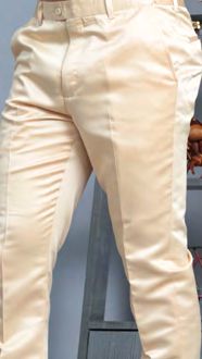 Someone wearing Manzini MANZINI MP-400 Champagne Satin Pants with belt loops stands beside a gray wooden chair.